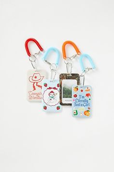 four different key chains with pictures attached to them