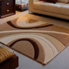 a living room area with couches and rugs