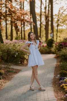 Teen girl poses on a stone path with flowers in the background for her senior session in Raleigh, North Carolina with Blythe Photo. Easy Senior Photo Poses, Cafe Senior Photos, 1 Person Photoshoot Poses, Senior Picture Ideas Formal Dress, Senior Picture Poses Gazebo, Rose Garden Senior Pictures, Senior Picture Poses Dress, Cute Poses For One Person, Senior Garden Pictures