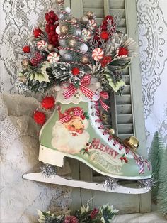 an ice skate decorated with christmas decorations and candy canes