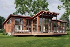 a large house sitting on top of a lush green field