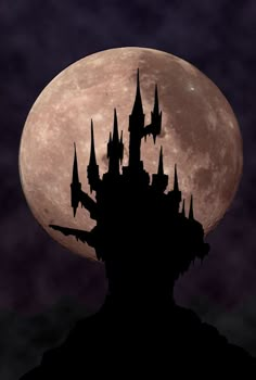 the silhouette of a castle against a full moon