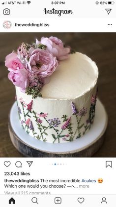 a white cake with pink flowers on it