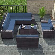 an outdoor patio furniture set with blue cushions