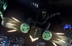 a man flying through the air while riding a skateboard in front of a city at night