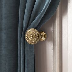 an open door with a curtain and knob on it