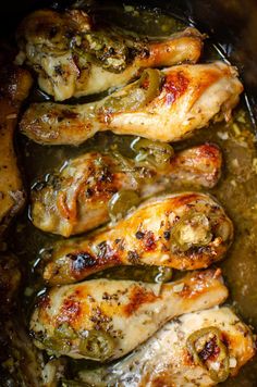 chicken and peppers cooking in a slow cooker