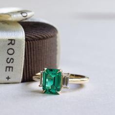 14K 1.4 CT Emerald Three Stone Ring – Rose & Choc Lab Grown Emerald Ring, Emerald Ring Designs, Emerald Three Stone Ring, Emerald Ring Design, Organic Engagement Rings, Pearl Rings Vintage, Ring Inspo, Antique Jewelry Rings, Diamond Girl