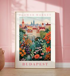 a flower market poster in front of a pink wall