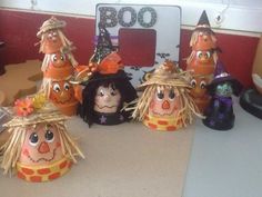 five scarecrow heads are sitting on a table