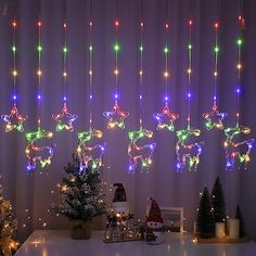 christmas lights hang from the ceiling above a table