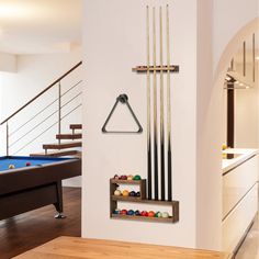 a pool table and billiards rack in a room