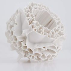 a white sculpture sitting on top of a table