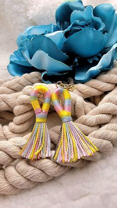 "✨️FREE SHIPPING (USPS First-Class Mail) and will ship out in ONE Business Day ✨️ \"Vibrant Striped Tassel Earrings: A Spring/Summer Symphony of Color\" Step into the bright side of fashion with our Vibrant Striped Tassel Earrings, tailored perfectly for the Spring and Summer seasons. Swirling in a harmonious yellow, blue, and pink blend, each tassel tells a story of vibrant sunsets, clear blue skies, and blooming flowers. Handcrafted with precision, these earrings exhibit the elegance of simpli Jewelry For Teens, Tassel Earring, Clear Blue Sky, Earring Jewelry, Bright Side, Blue Skies, Blooming Flowers, Summer Season, Tassel Earrings