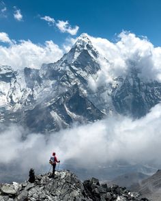 a man standing on top of a rocky mountain