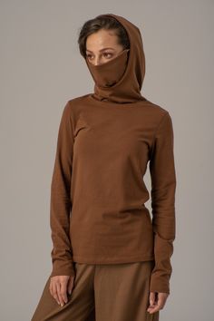 "Hoodie with Mask, Face Mask Hoodie, Cotton Hoodie Women ABOUT THE COTTON HOODIE: Enjoy our new Item - Elegant Hoodie with Face Cotton Mask. The Hoodie is very comfortable, trendy and minimalist urban style. You will feel at home at the same time freely and feminine. The design of the Mask is with quality cotton fabric inside and Tricot fabric outside combined with The Hoodie. You can wear the Hoodie every day in casual style. The Hoodie is in Cinnamon Color. We offer you in different colors. Pl Long Sleeve Fall Outdoor Hoodie, Solid Color Hoodie With Drawstring Hood, Solid Color Hoodie For Outdoor Fall Wear, Solid Color Hoodie With Detachable Hood And Long Sleeves, Solid Color Hoodie With Detachable Hood, Outdoor Sweater With Drawstring Hood And Long Sleeves, Solid Color Long Sleeve Hoodie With Detachable Hood, Solid Long Sleeve Hoodie With Detachable Hood, Outdoor Long Sleeve Sweater With Drawstring Hood