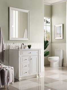 a bathroom with a checkered floor and white fixtures, including a toilet, sink, mirror, and bathtub