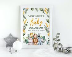 a baby announcement with an elephant, giraffe and zebra on the front cover