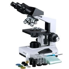 a microscope with several different items in front of it