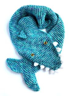 a knitted scarf with an alligator's head on it