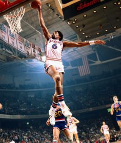 a basketball player dunking the ball into the air