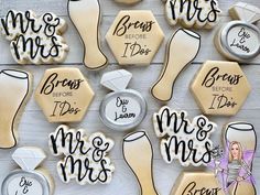 decorated cookies are arranged on a table for someone's bridal party or special occasion