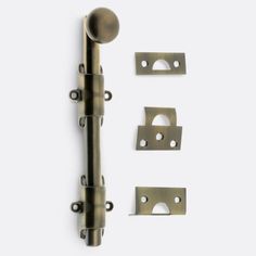 an assortment of metal hardware on a white background