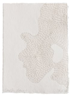 a piece of paper that has been drawn on it with white ink and some type of paint