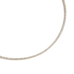 Designed with comfort in mind, the 6 Carat Classic Tennis Necklace is handmade to be fluid, not rigid, allowing it movement for comfortable wear. It features prong-set brilliant round diamonds that wrap 360° around the neck allowing diamonds to sparkle from all angles. Round Diamond Tennis Necklace, Minimalist Diamond Necklace With Sparkling Stones, Minimalist Round Tennis Necklace With Diamond Accents, Minimalist Round Diamond Tennis Necklace, Minimalist Tennis Necklace With Diamond Accents, Tennis Necklace, Rough Diamond, Recycled Gold, Diamond White