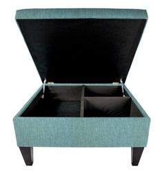 an upholstered blue ottoman with two open compartments on the bottom and one closed