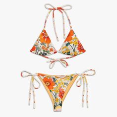 Floral Print String Bikini With Yellow Lining. - Upf 50+ Protection - Made From 88% Recycled Poly Spandex - Removable Padding Brand New With Tags. This Was A Sample And Has Never Even Been Tried On. Floral Print Stretch Swimwear With Tie-side Bottom, Fitted Tropical Swimwear With Tie-side Bottom, Printed Triangle Top Swimwear, Fitted Floral Print Swimwear With Triangle Top, Fitted Floral Print Triangle Top Swimwear, Printed Fitted Swimwear With Tie-side Bottom, Printed Fitted Tie-side Bottom Swimwear, Printed Fitted Tie-side Swimwear, Fitted Floral Print Tie-side Swimwear