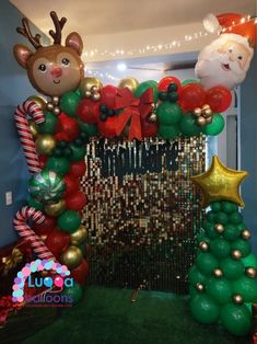 an arch decorated with christmas decorations and balloons