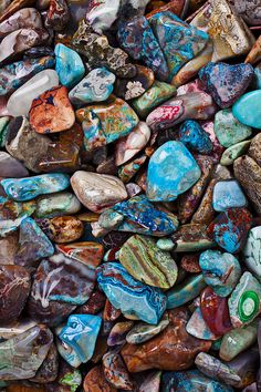 many different colored rocks and stones on top of each other, all together in the same pattern