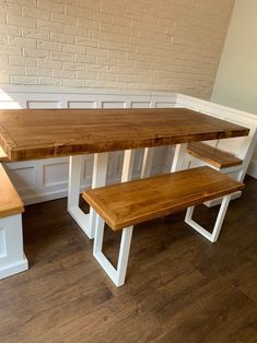 a wooden table and benches in a room