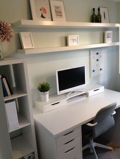 a white desk with a computer on top of it