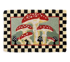 a rug with three mushrooms on it and checkered border around the edges, in front of a white background