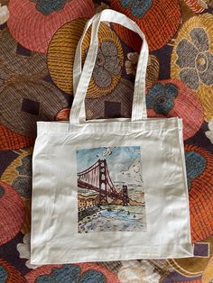 Tote bag printed with Golden Gate Bridge watercolor illustration. Graphic Print Rectangular Canvas Bag Gift, Bridge Watercolor, San Francisco Golden Gate Bridge, Handmade Tote, Tote Bags Handmade, Printed Bags, Golden Gate Bridge, Golden Gate, Cotton Totes