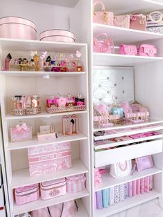 the shelves are filled with pink and white items