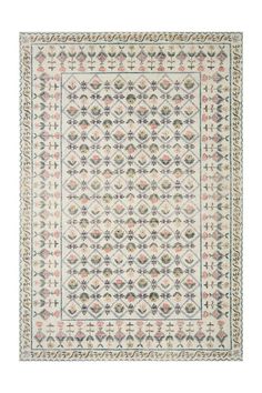 a white rug with an intricate design on the front and back sides, in various colors