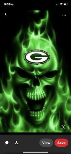 a green bay packers skull with flames in the background