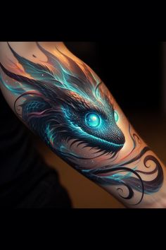 a man's arm with a dragon tattoo on it and an eye in the center