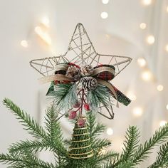 a christmas ornament hanging from the top of a tree