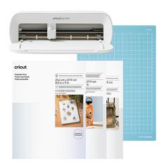 the cricut machine is next to an instruction manual