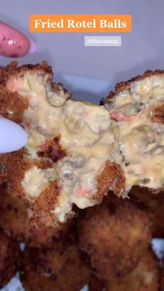 fried rotel balls with cheese being dipped into them