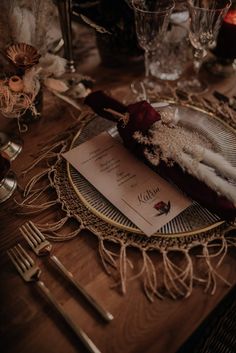 a table setting with place settings and silverware