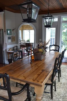 a wooden table sitting in the middle of a living room