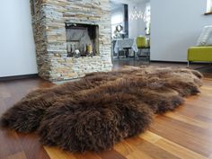 a living room filled with furniture and a fire place