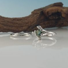 Made-to-Order Custom Twig Bridal Set using a Beautiful Natural Green Montana Sapphire Gemstone Ring. Hand sculpted Twig Bridal Set, hand sculpted, a one-of-a-kind creation. I wanted to create a beautiful yet elegant bridal set using a polished faceted Gemstone using my organic twig design. ● 5.2mm aproximately 1/2 carat round polished faceted natural Montana Sapphire (SHOWN) OPTIONS: So many round 1/2 carat gemstones are available to use in my twig setting. To name a few, Opal, Sapphires, Rubies Rough Diamond Engagement Ring, Twig Wedding Band, Green Montana, Silver Flower Necklace, Ring Hand, Montana Sapphire, Bridal Set, Sapphire Gemstone, 2 Carat