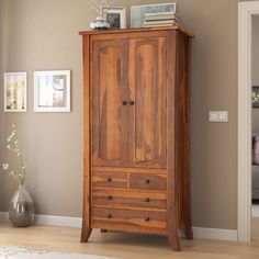 Add more storage to your bedroom, or anywhere throughout your home, with the charm and elite functionality of our Georgia Rustic Solid Wood Wardrobe Armoire Closet with 4 Drawers. In an innovative design meant to marry the serviceability of a closet with the functionality of a chest of drawers, this traditional armoire will become the heart of your organized household. The double cabinet doors open in invitation to provide a place to fold or hang your clothes thanks to the addition of removable Armoire For Sweaters, Shirt Armoire, Closet Armoire, Clothing Armoire, Armoire Closet, Closet Furniture, Wooden Almirah, Solid Wood Armoire, Hardwood Bedroom