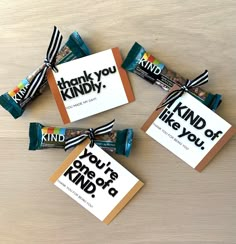 candy bar wrappers with thank you kindly written on them and tied in black and white ribbon